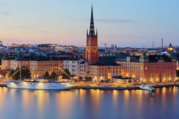 night time view of the Stockholm skyline featuring Gamla stan, and Riddarholmen (Sweden).