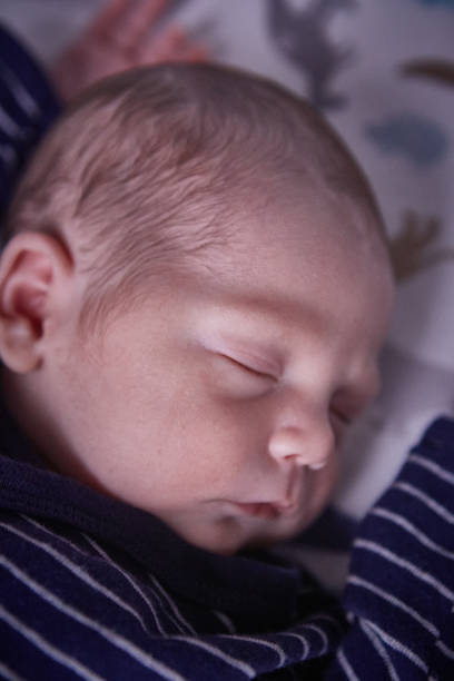 istock Newborn baby boy sleeping 1424339987