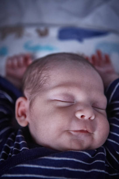 istock Newborn baby boy sleeping 1424340110
