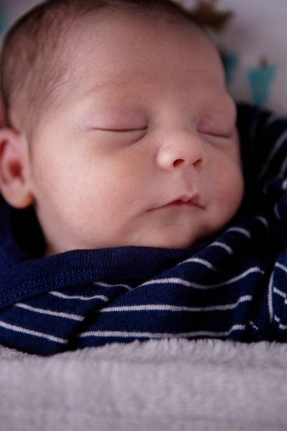 istock Newborn baby boy sleeping 1424340876