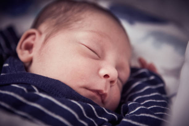 istock Newborn baby boy sleeping 1424340879