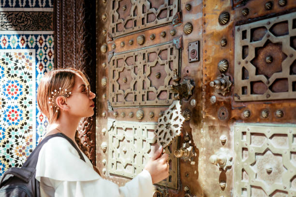 woman knocking on a sacred door stock photo