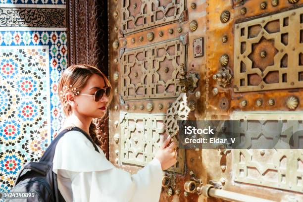 Woman Knocking On A Moroccan Door Stock Photo - Download Image Now - Adult, Adults Only, African Culture