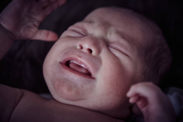 istock Newborn baby boy crying 1424340992
