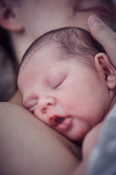 istock Newborn baby boy with mother 1424342997