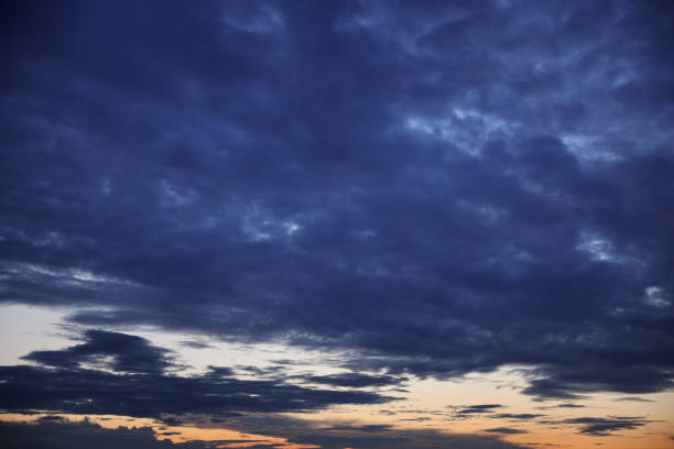 istock Dark stormy sky sunset clouds in summer europe 1424343909