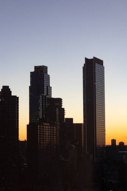 istock Buildings in New York illuminated by sunset 1424345208
