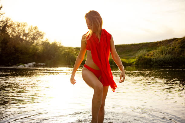 istock Beautiful woman on the river 1424352694