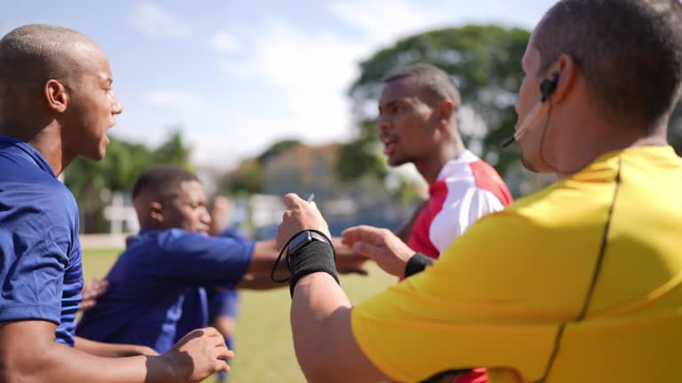 Soccer players fighting during a match