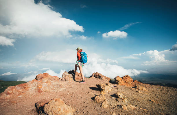 istock Hiker woman standing on viewpoint 1424357186