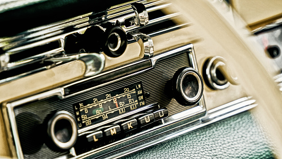 Close Up At A Dashboard With A Radio In A Vintage Car