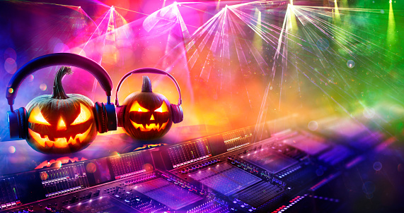 Pumpkins With Headphones In Colorful Nightclub