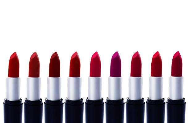 istock Modern lipstick color shades backdrop with white empty space for text. Fashion banner background with lipsticks 1424365035
