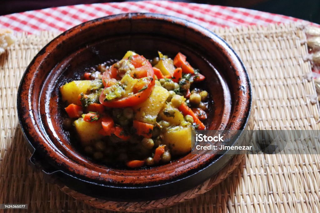 Vegetable tagine, typical dish of Moroccan food Vegetable tagine, typical dish of Moroccan food. Contains tomato, chickpeas and other vegetables. Tajine Stock Photo