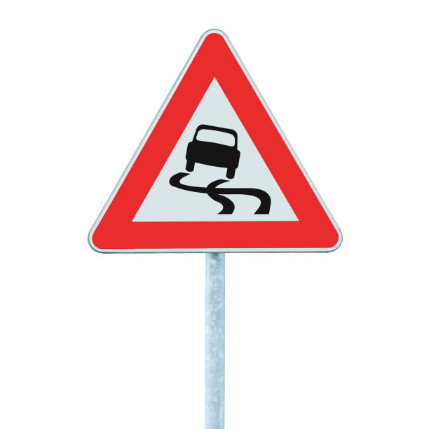 istock Slippery when wet warning road sign, isolated grey pole post, large detailed vertical closeup, red frame, triangular traffic signage 1424370676