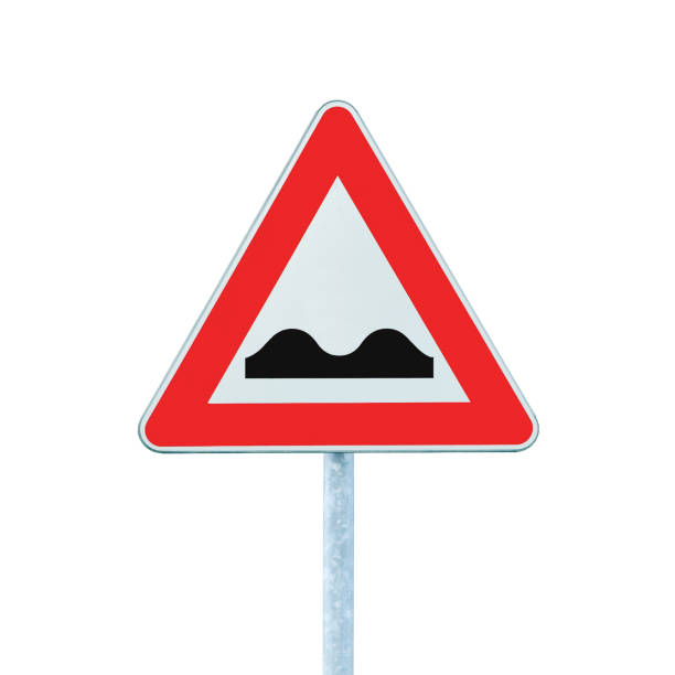 istock Uneven road sign, isolated red triangle frame, grey pole post, large detailed vertical closeup, white background 1424370701