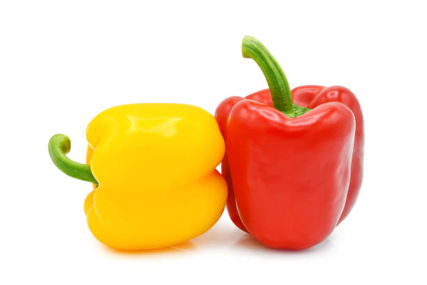 Yellow and red bell pepper isolated on white