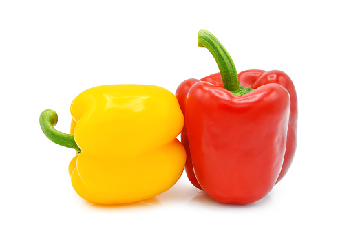 Yellow and red bell pepper isolated on white background.