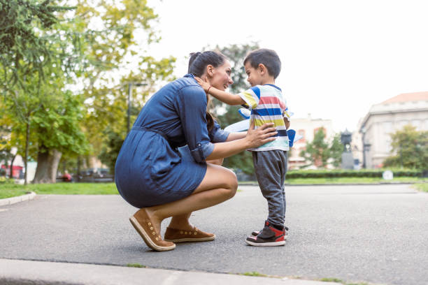 istock Mother and son playing with a model airplane toy 1424377402