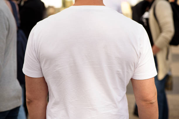 istock Unrecognizable man dressed white t-shirt. Template for your design. Rear view. Closeup. 1424377692