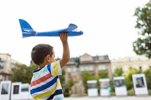 Free Stock Photo of Boy Playing With Toy Airplane | Download Free ...