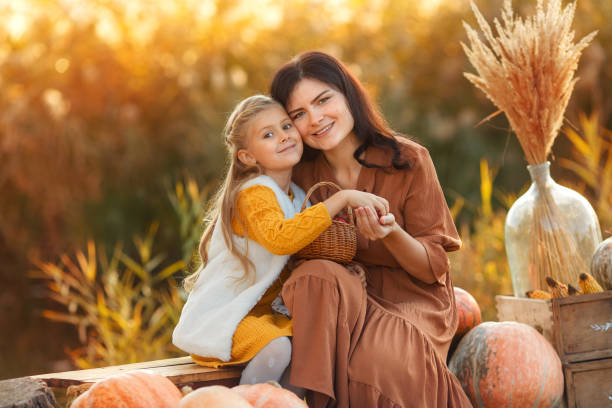istock Mom and daughter at the sunset. 1424379913
