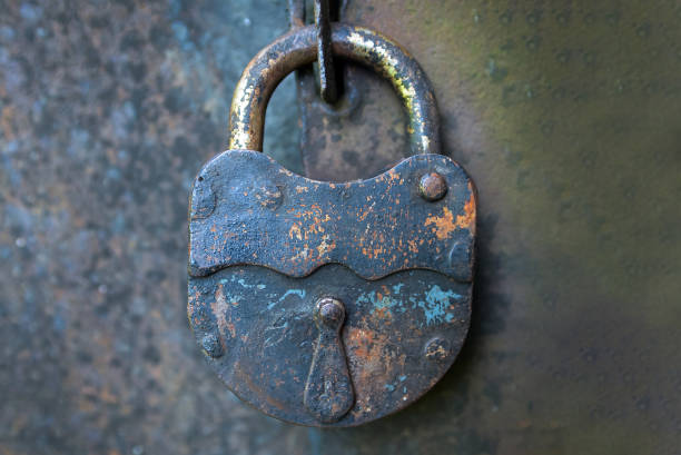 istock Old metal padlock on a door 1424380006