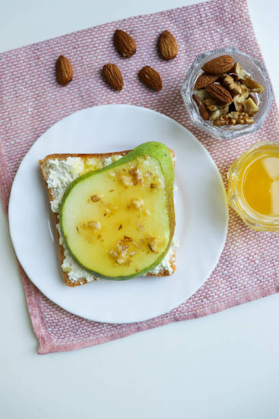 istock sandwich with cottage cheese, pear, honey and nuts 1424380443