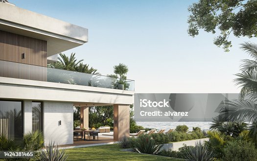 istock Modern villa with two floors overlooking sea 1424381465