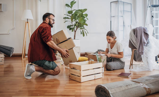 istock Couple moving in new home 1424382496