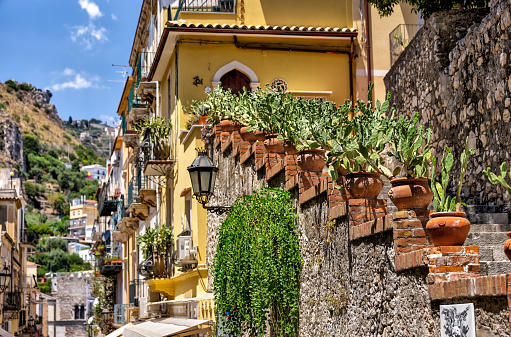 Taormina, Italy - July 22, 2022: Scenic streets and sidewalks in Taormina, Sicily