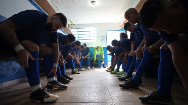 Soccer team preparing for match in the locker room