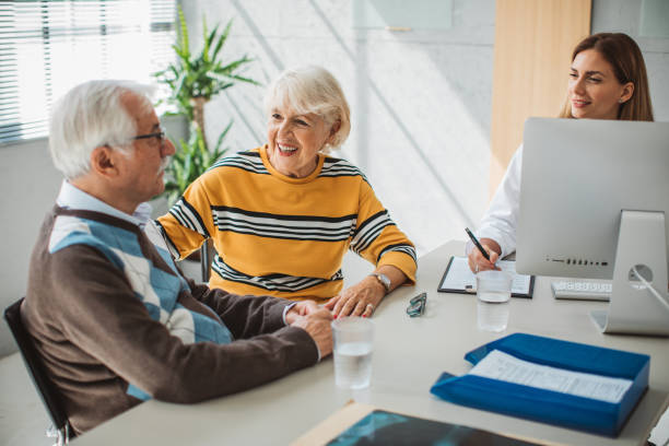 istock Senior couple visiting doctor 1424397284