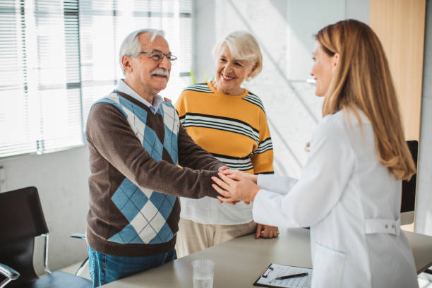 istock Senior couple visiting doctor 1424397322