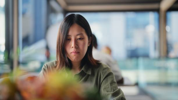 istock Businesswoman working on laptop in modern office working space 1424399304