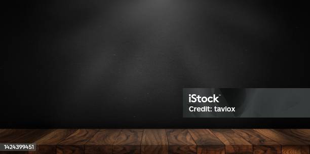 Wooden Table Made With Natural Wood Planks With A Concrete Block Wall Background In A Dark Room Rustic Environment To Display Artisan Elements Meats Or Mediterranean Products Stock Photo - Download Image Now