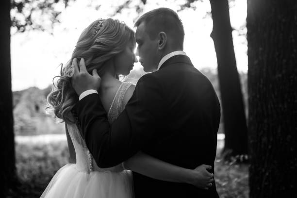 istock Young couple enjoying romantic moments while walking in the park. 1424400351