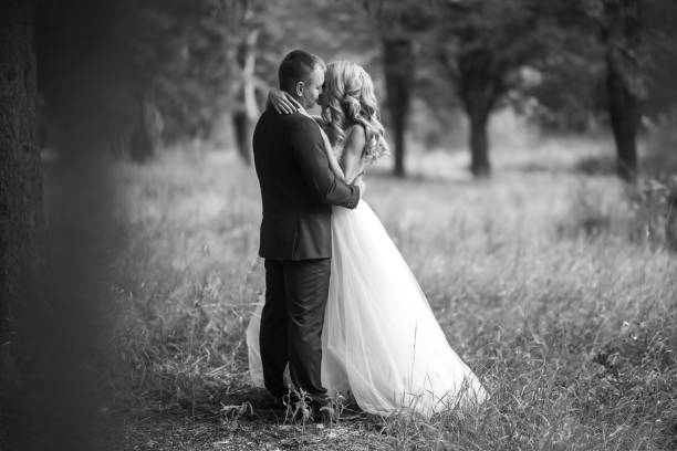 istock Young couple enjoying romantic moments while walking in the park. 1424400361