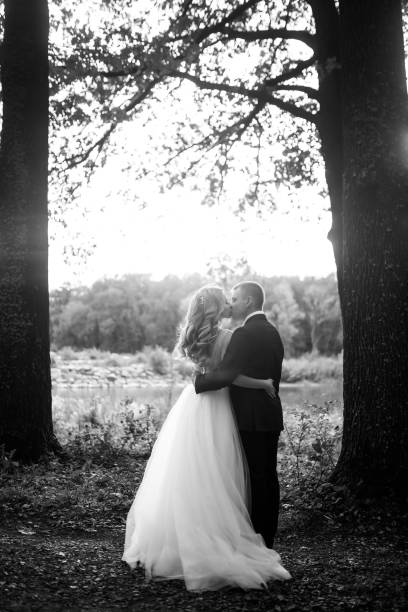 istock Young couple enjoying romantic moments while walking in the park. 1424400369