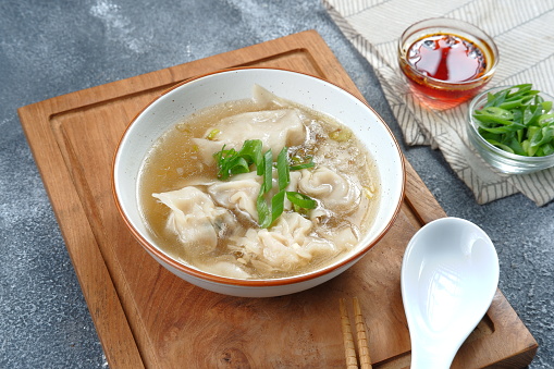 Delicious of wonton soup with chili oil and green onion,chinese food,asian food style