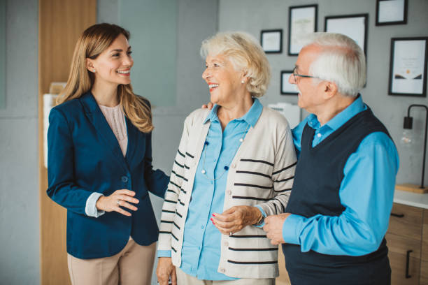 istock Senior couple consulting with female advisor 1424414167