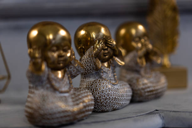 Three Wise little Buddha figurine in a row, Hear no evil, See no evil, Speak no evil, Bronze little statue home decoration concept