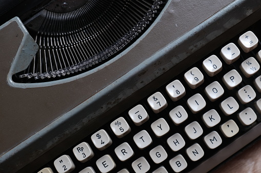 Close up of the type letters on an old typewriter.