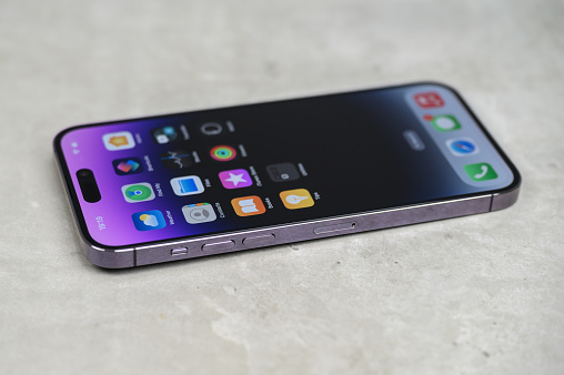 Koszalin, Poland - Jun 01, 2015: Close-up shot of white iPhone 6 Plus and white Samsung Galaxy Note 4 hand-held by woman. IPhone 6 Plus (5.5 inches) is biggest smartphone from Apple. Samsung Galaxy Note 4 is his competitor from Samsung. Devices displaying the applications on the home screen.