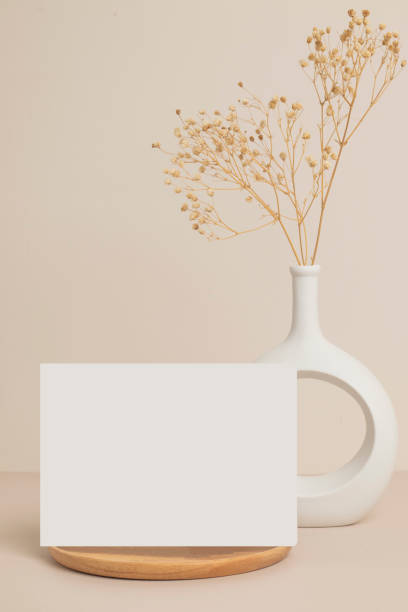 istock greeting card front view and dry flower in vase ceramic on table 1424439589