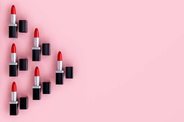 istock Cosmetics beauty products red lipsticks on a pink background. 3d render of Creative pattern fashion. 1424447110
