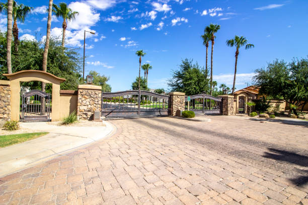 istock Entrance And Exit Gates At Secure Housing Subdivision 1424448890