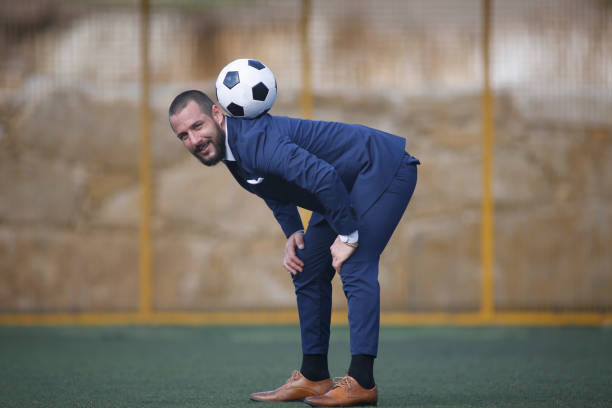 istock Businessman playing soccer ball. 1424455072
