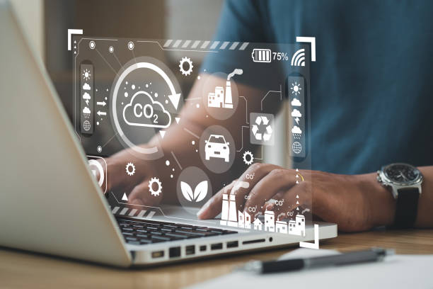 istock Business man using computer on CO2 emission reduction concept with global warming icon. along with climate, energy, sustainability, environment 1424456636