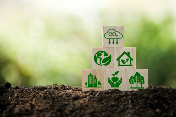 istock Carbon neutral and net zero concept natural environment Climate-neutral long-term strategy greenhouse gas emissions targets Wooden block with green net center icon 1424456647